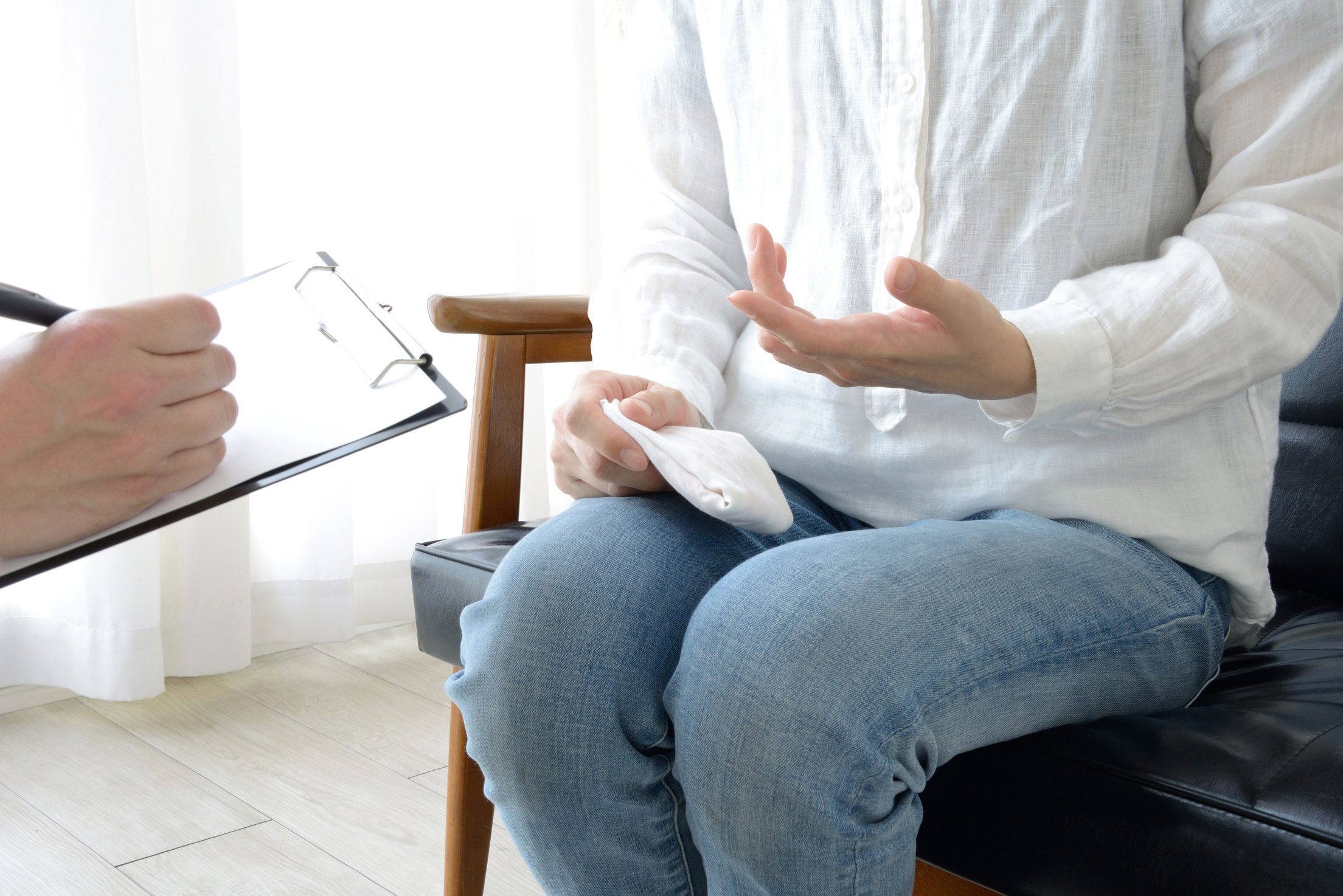 Councelling scene, woman explaining to counselor